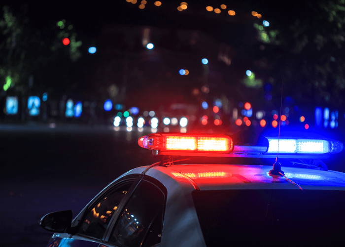 cop car out at night in the city