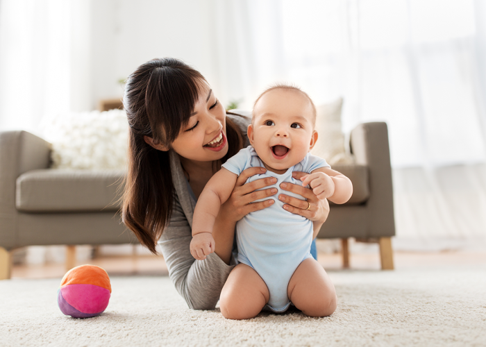 An asian mom with her baby.
