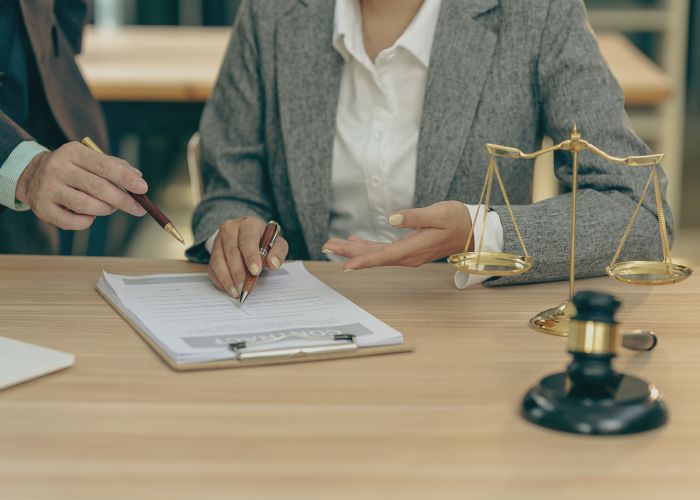 Courtroom, legal counsel with gavel and law. Justice and lawyer concept. Judge's gavel on table, close up.