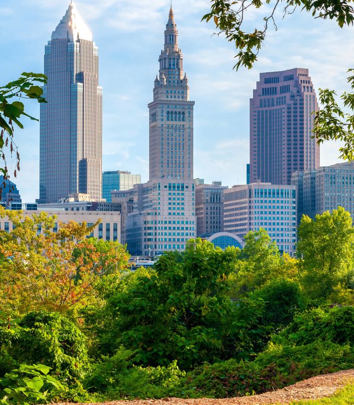Downtown Cleveland, Ohio, framed by trees in a small park
