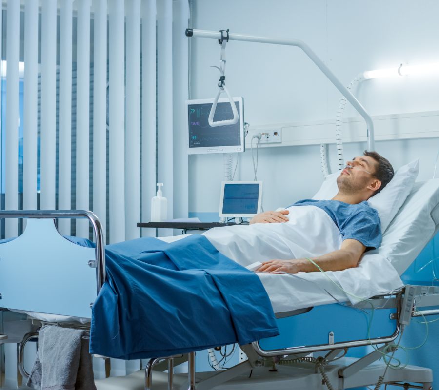 Injured man in hospital bed