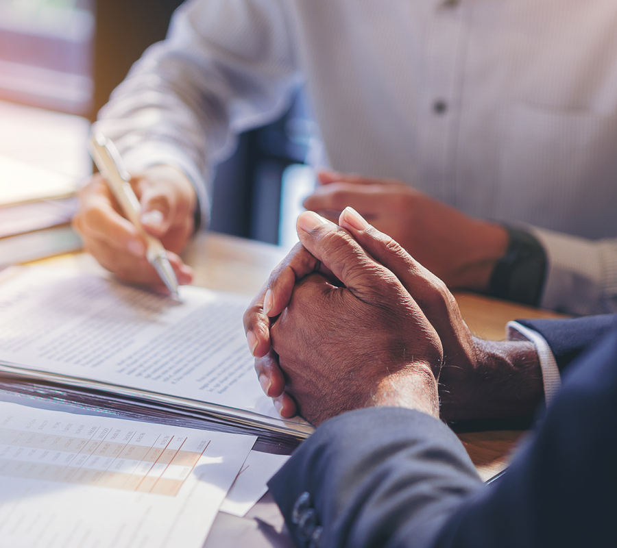 Business people signing paperwork