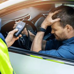 A man in a car, failing a DUI test