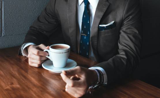 Attorney holding a cup of coffee