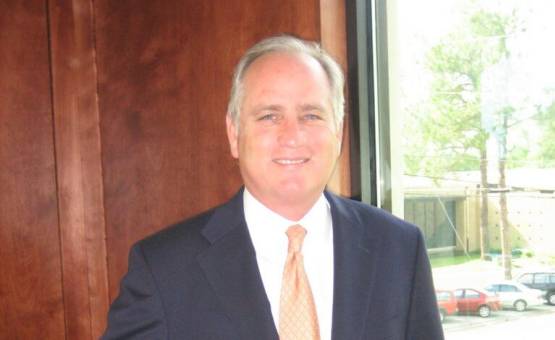 attorney tim weaver standing and smiling