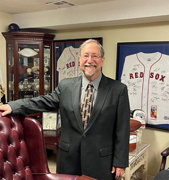 Attorney Michael Kaplan standing in his office