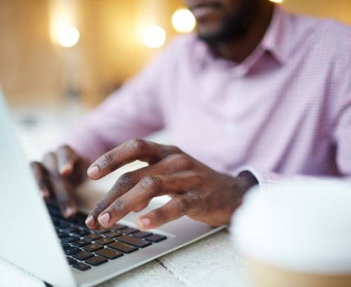 man sitting at a computer