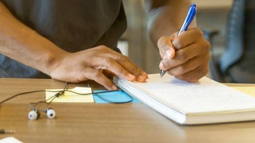 Man writing in a notebook
