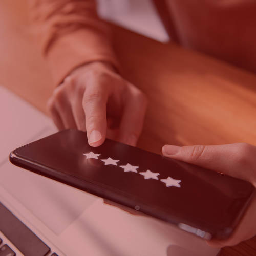Woman putting a review on her phone