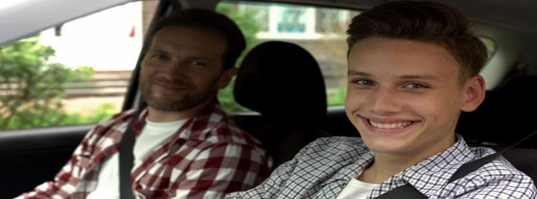 Smiling Teenager in car with Man