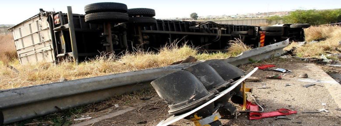 Semi truck flipped over a guardrail