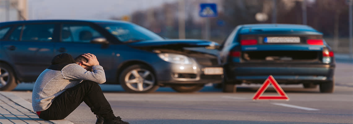 Sad man after car accident