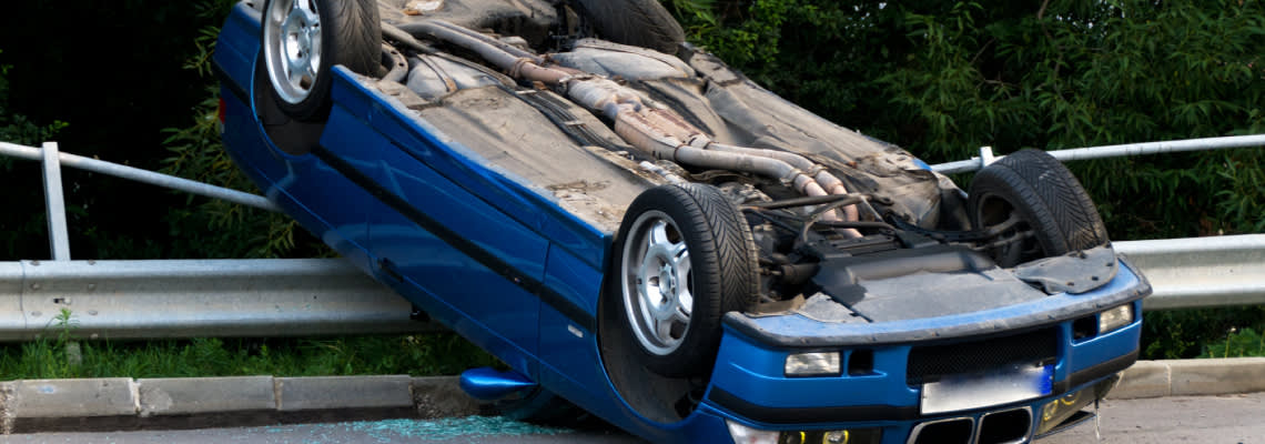 Rollover car accident on road