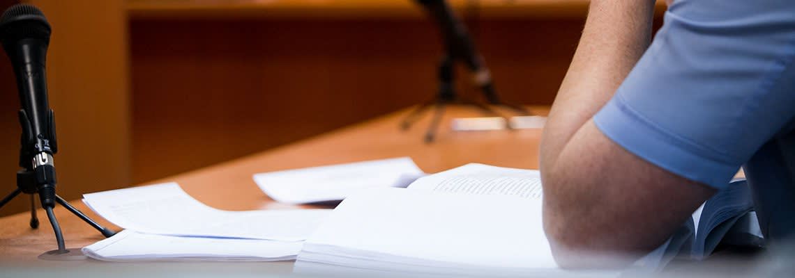 Lawyer in court with documents
