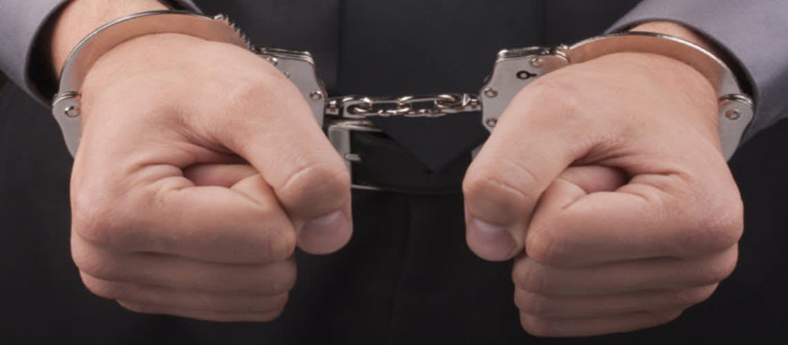Hands in cuffs