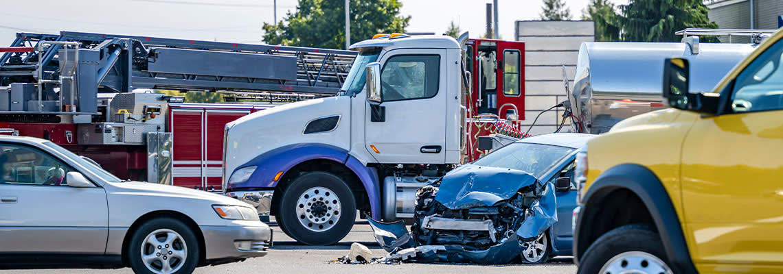 Collision of car and truck at intersection