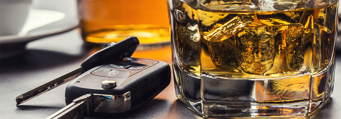 Glasss of alcohol and car keys