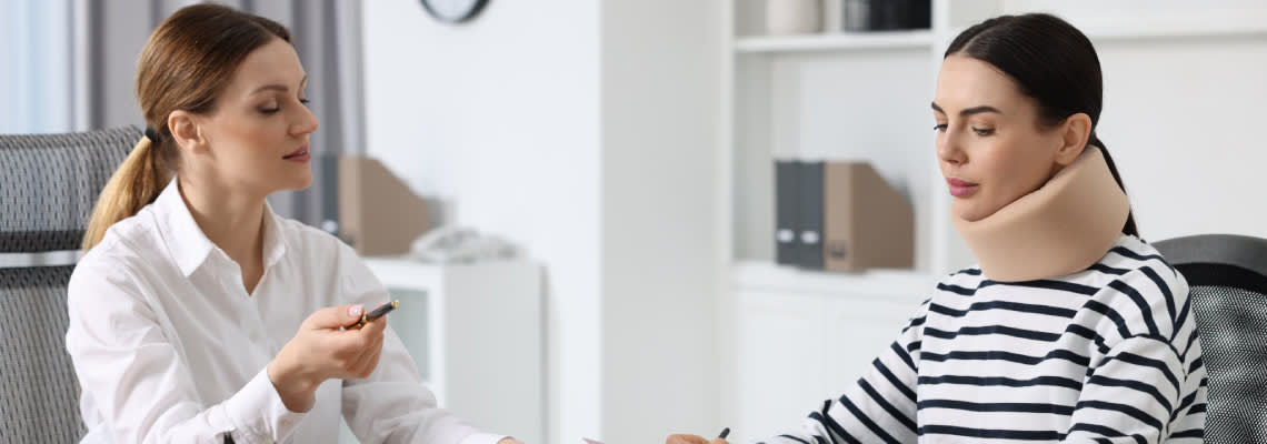 Injured women consulting with attorney