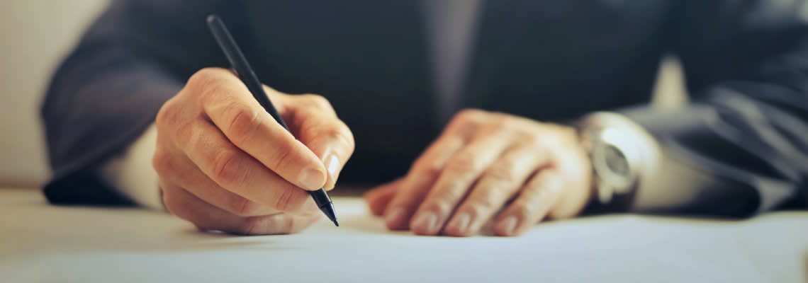 Man signing a document