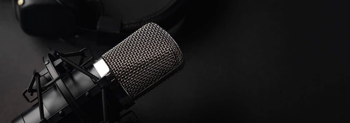 Podcast microphone on a black background