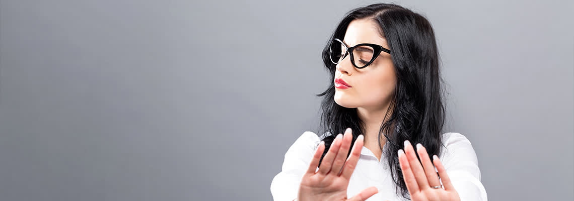 Lady saying no and holding up hands