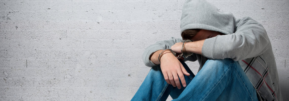 Handcuffed teenager