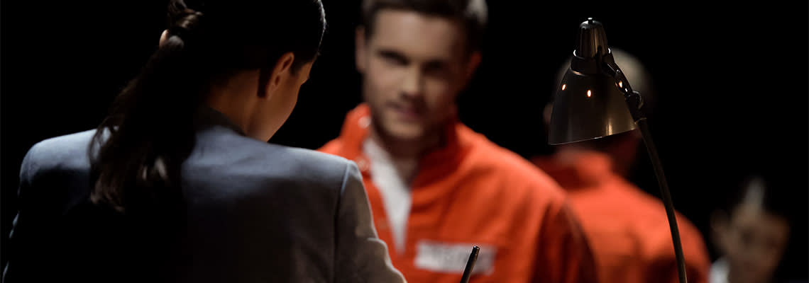 Defense attorney writing statement of accused criminal