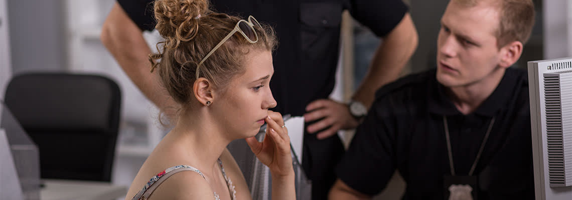 Policeman questioning women