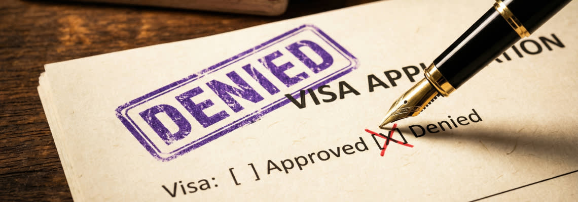 Denied stamp on a visa application form