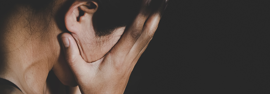 Person with their head in their hands