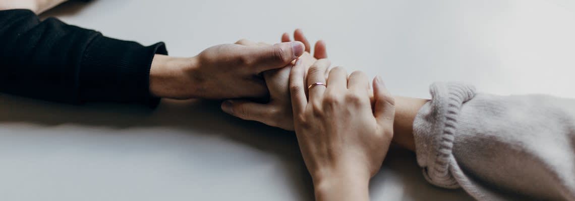 Hands Holding with Wedding band