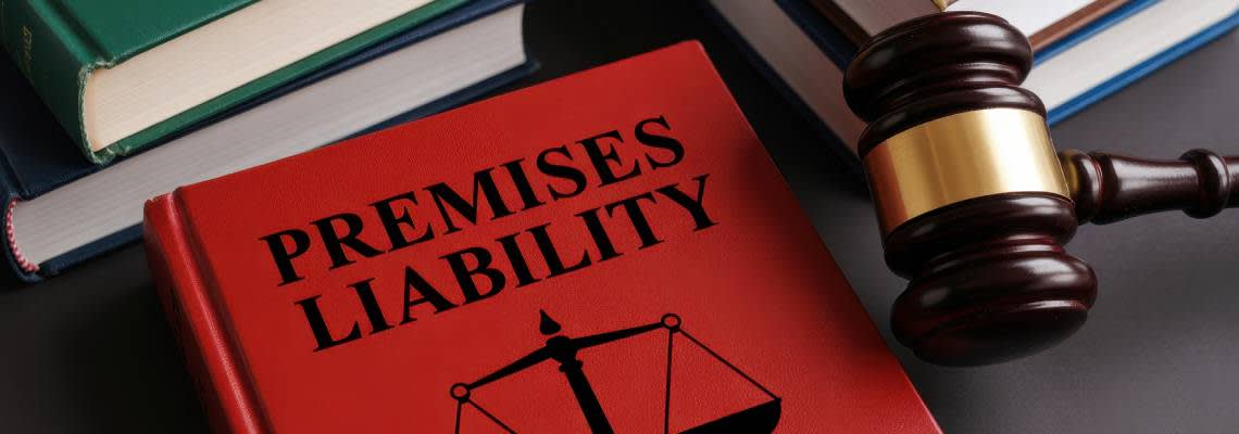 Premises Liability law book and gavel in table