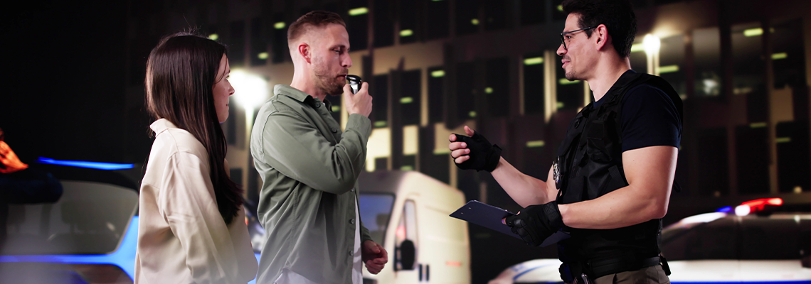 Police Officer Conducts Blood Test on Road