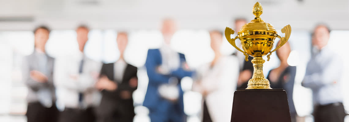 Team behind Trophy celebrating organizational success