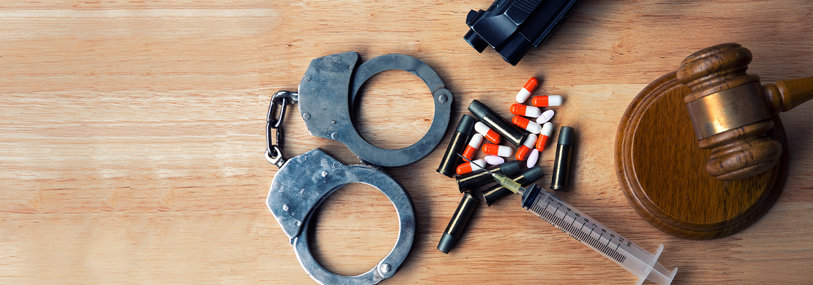 Bullet with a hammer of the judge, handcuff and drugs