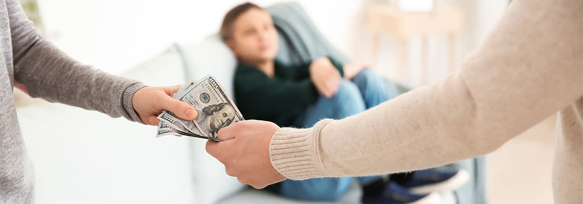 Man handing alimony money to wife