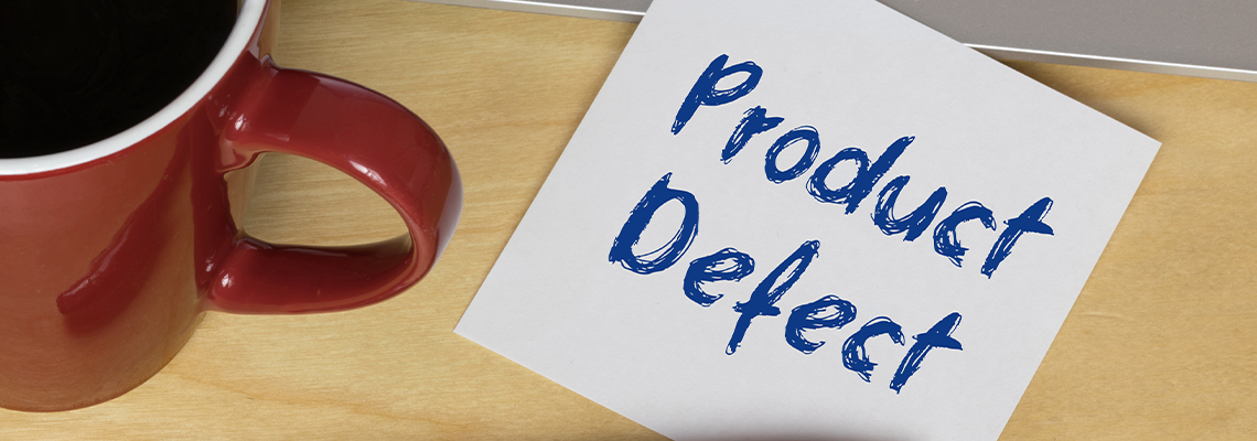 Product Defect written on Paper and pen