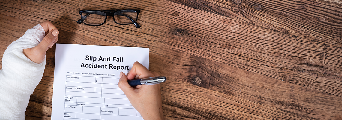 Woman Hand Filling The Slip And Fall Injury Report