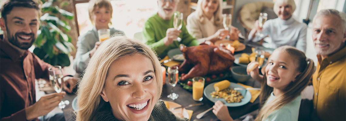 Photo of Big Family Sit Feast Dishes Table Around Roasted Turkey