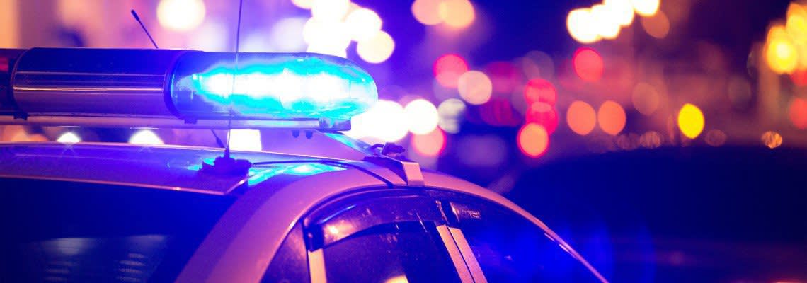 action shot of police vehicle at traffic stop