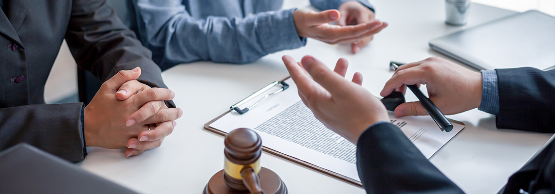 Businessman and lawyer discuss the contract document