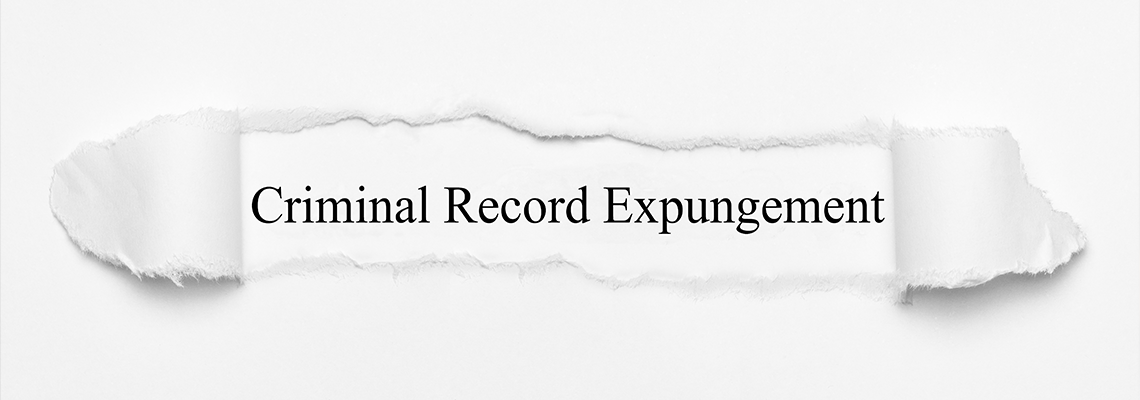 Criminal Record Expungement on white torn paper