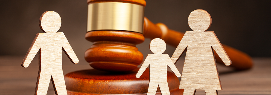 Child custody wooden figure of family