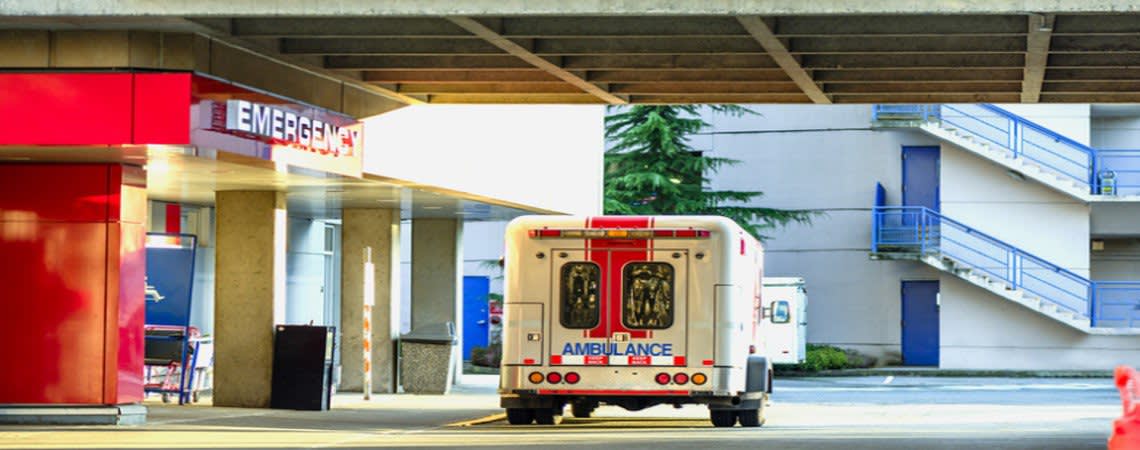Ambulance parked outside of an emergency room