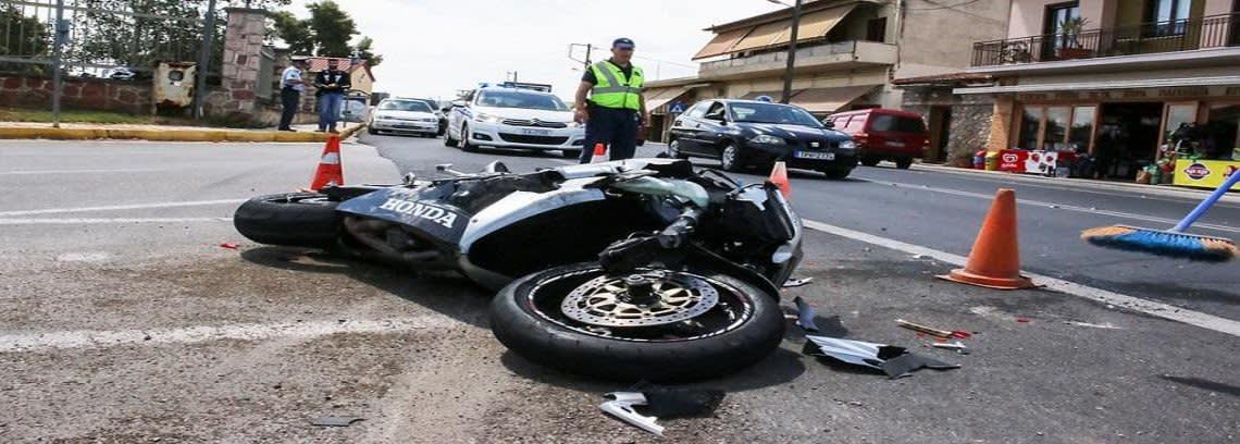Crashed motorcycle resting in an intersection