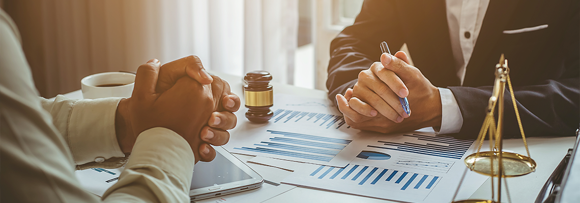 Business lawyer working about legal legislation in courtroom to help their customer