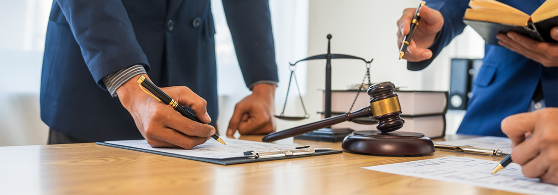 A team meeting of clients and a lawyer in formal suits