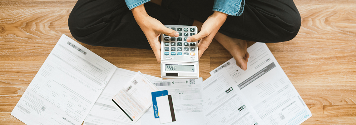 Top view man sitting on the floor stressed and confused by calculate expense