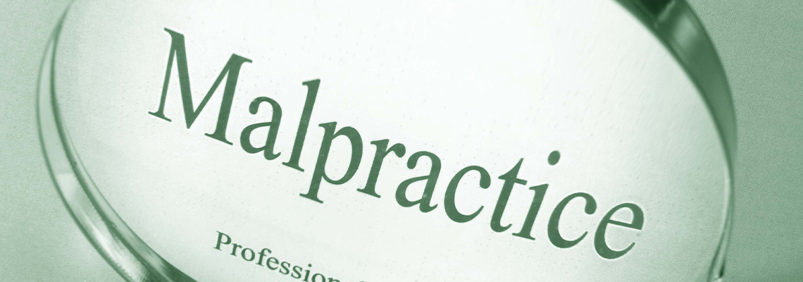 Malpractice written on a glass