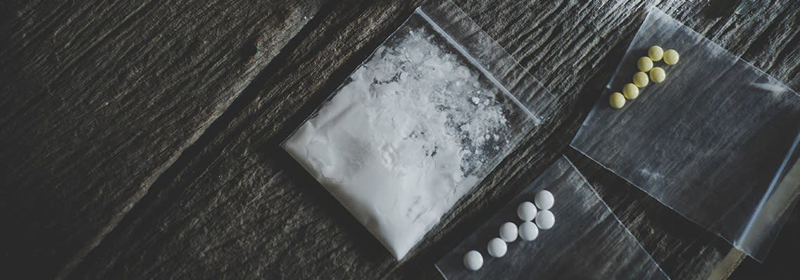 Pills and powder in little baggies